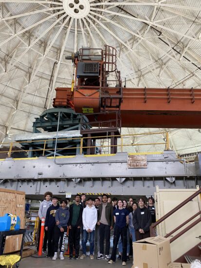A group of you people in front of the yoke under the ASL dome.