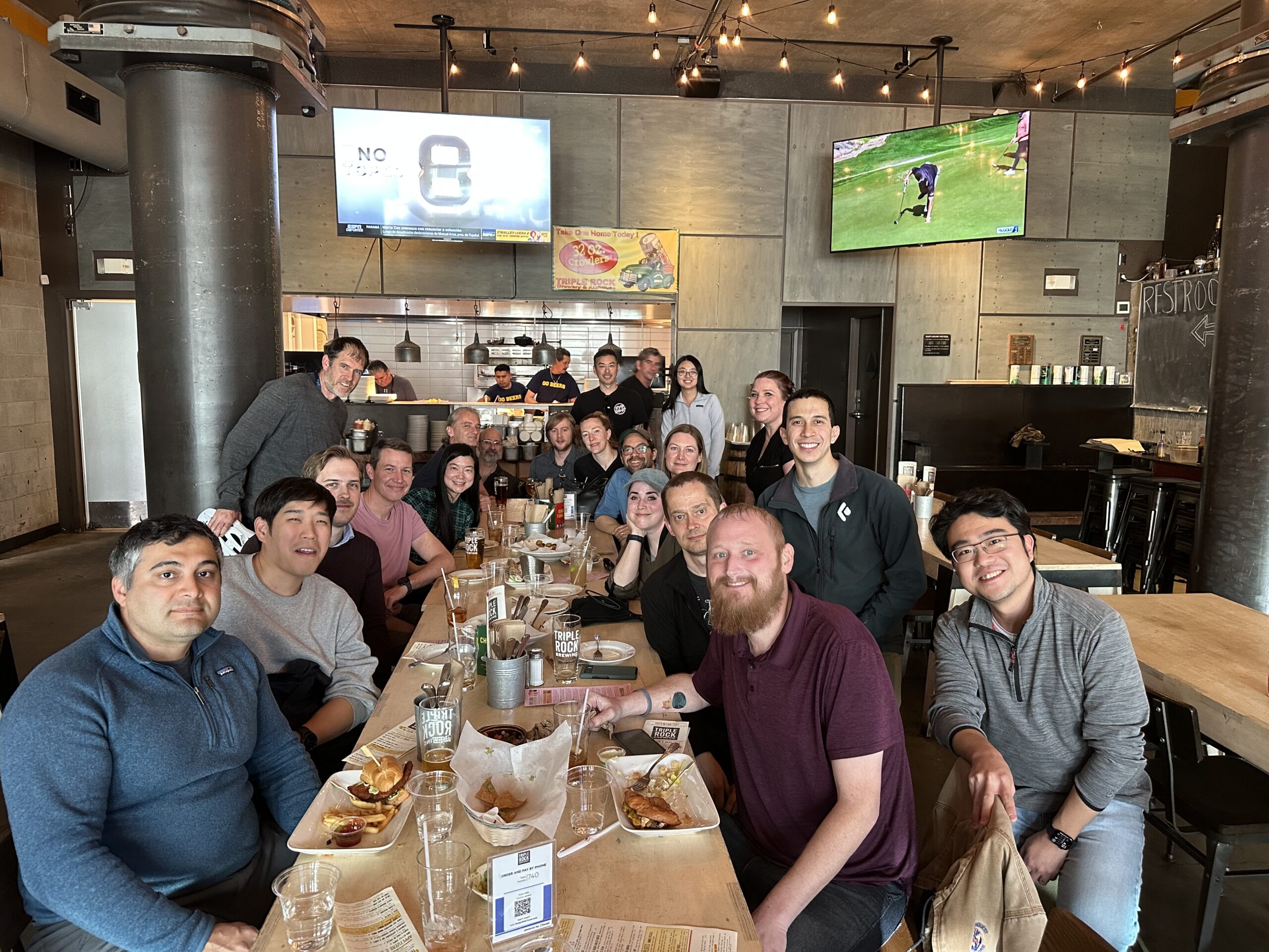 a group of people at a rectangular table