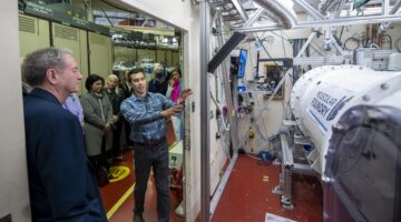 Scientist giving a tour to a group of people at the Molecular Foundry.