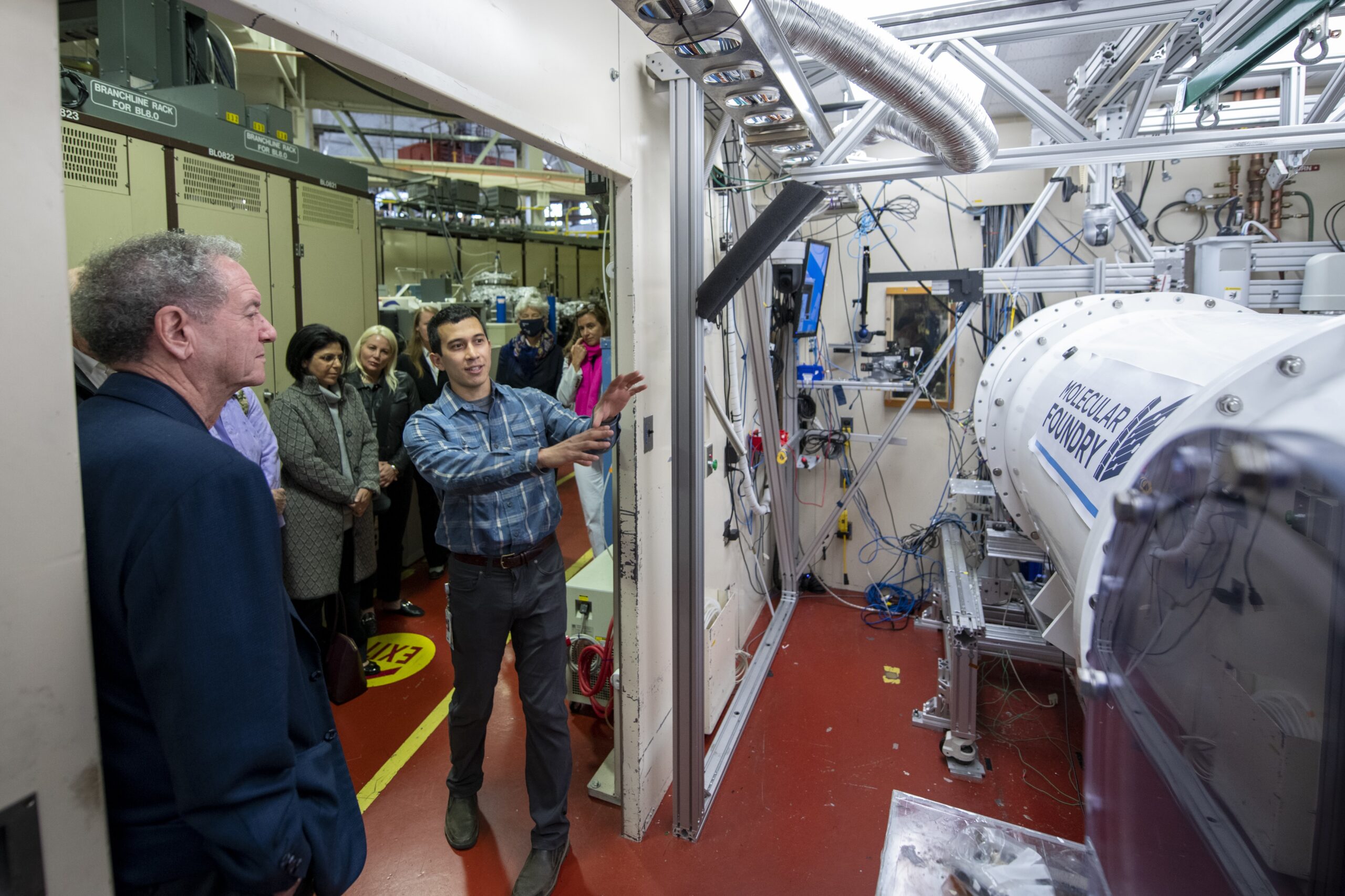 Scientist giving a tour to a group of people at the Molecular Foundry. 