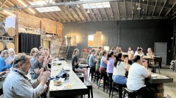 A crowd of people clapping.