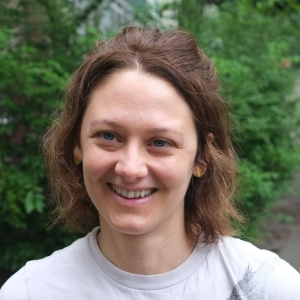 Woman with white shirt on.