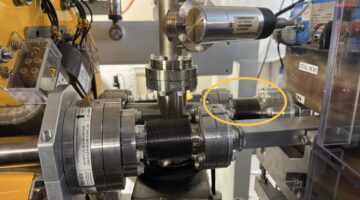 Vacuum chambers and magnets, a bellows is highlighted with a yellow ellipse around it.