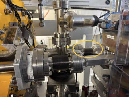 Vacuum chambers and magnets, a bellows is highlighted with a yellow ellipse around it.