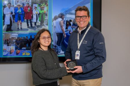 Two people smiling at the camera.