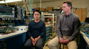 Two men in an electronics lab.