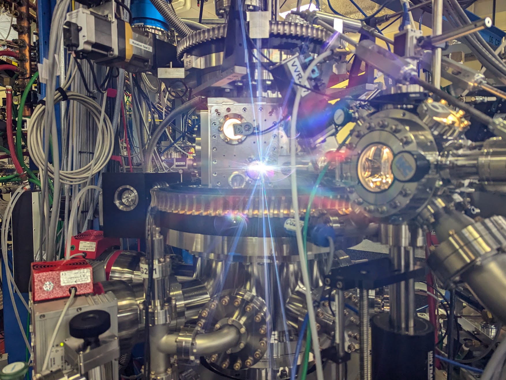 Rays of light stream out of a scientific instrument 